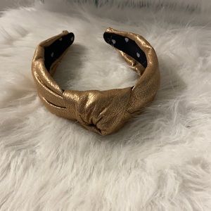 Gold faux leather Lele Sadoughi headband. GUC